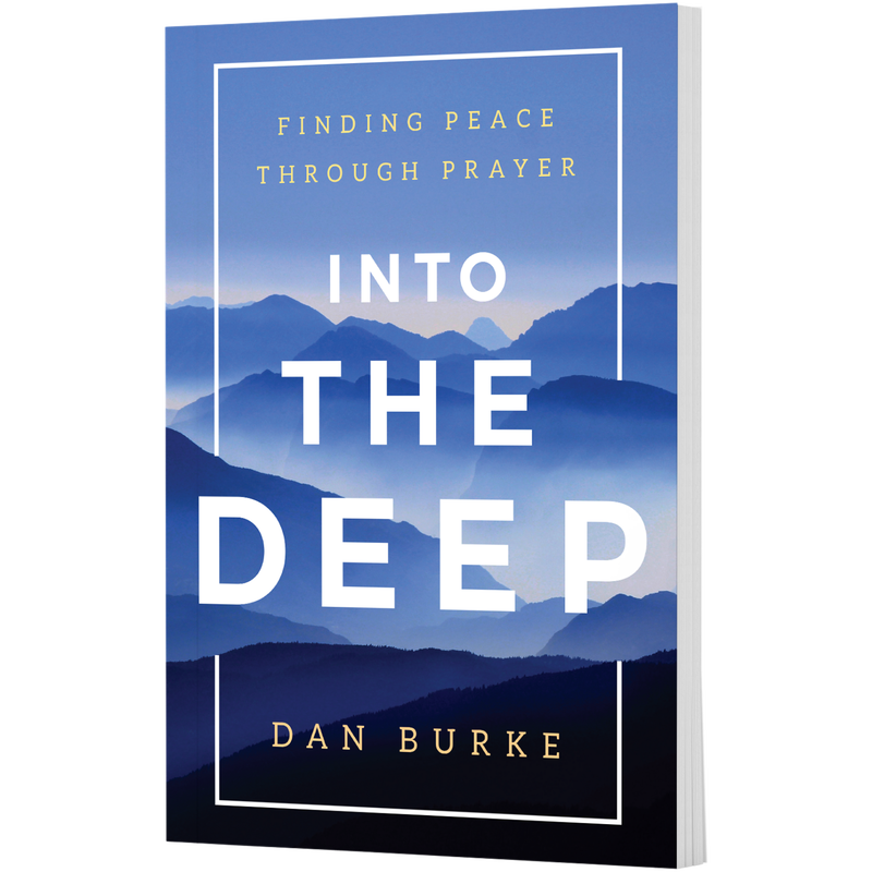 Book cover titled Into the Deep: Finding Peace Through Prayer by Dan Burke, featuring a landscape of blue mountains. image number 0