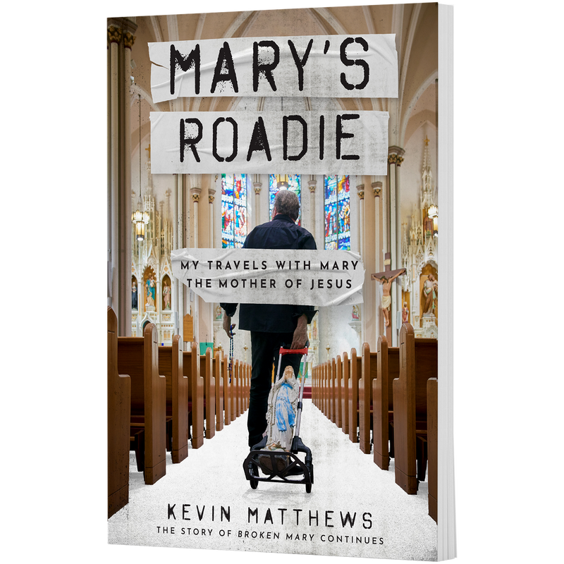 Book cover titled Marys Roadie by Kevin Matthews, featuring a man pushing a cart with a statue of Mary through a church. image number 0