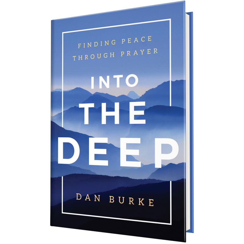 Book cover titled Into the Deep: Finding Peace Through Prayer by Dan Burke, featuring a landscape of blue mountains. image number 0