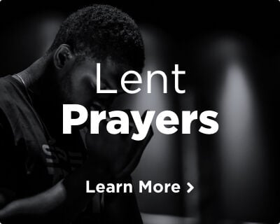 A man praying with his eyes closed, hands clasped, and head bowed reverently. Image links to prayers for Lent page.